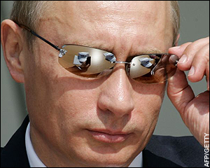 Vladimir Putin in mirrored sunglasses.