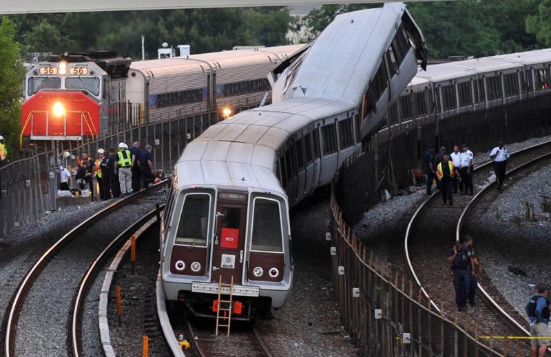 MARC / Maryland Area Regional Commuter train passing a wrecked Washington D.C. Metro Red Line train after an accident in August 2009.