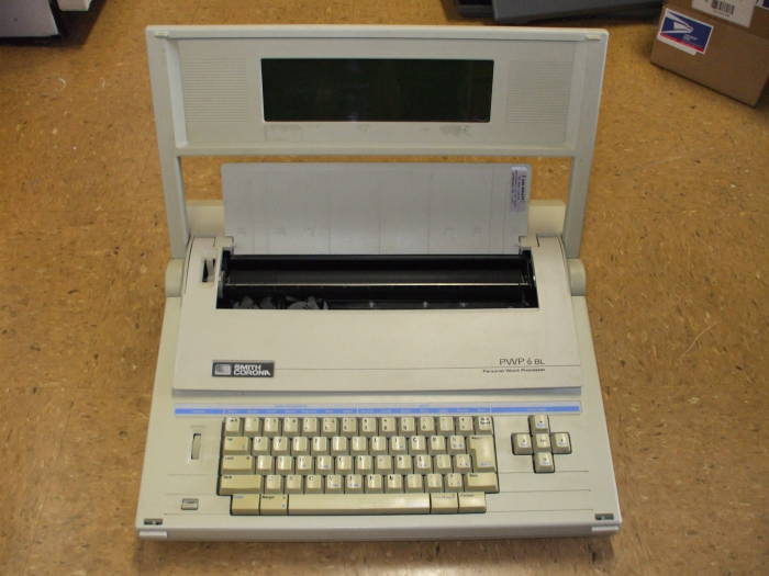 A Smith-Corona Personal Word Processor fully opened.