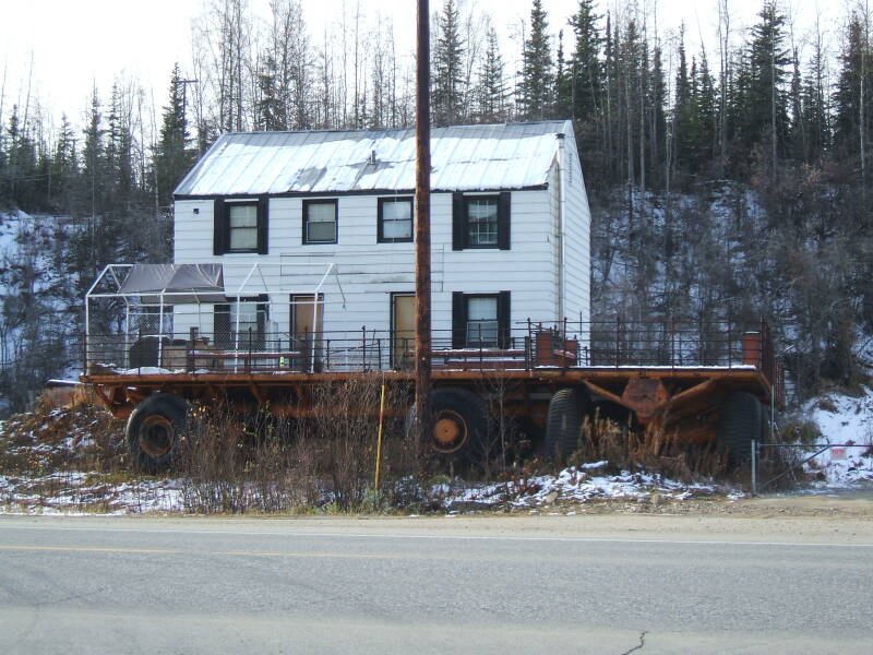 Eccentric house near the Alaska Pipeline just north of Fairbanks.  Two tundra buggies and a radome.