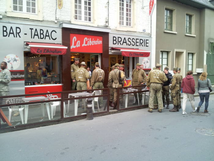 French and Belgian reenactors at a brasserie in Sainte-Mère-Église.