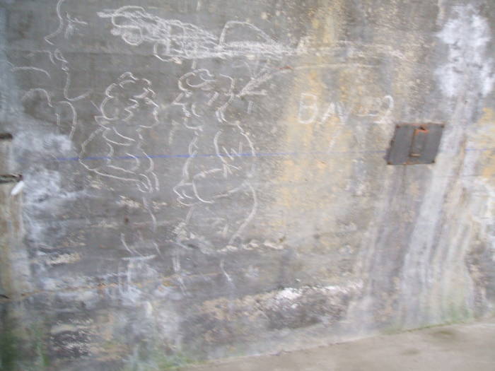 WWII graffiti inside a hanger in France.