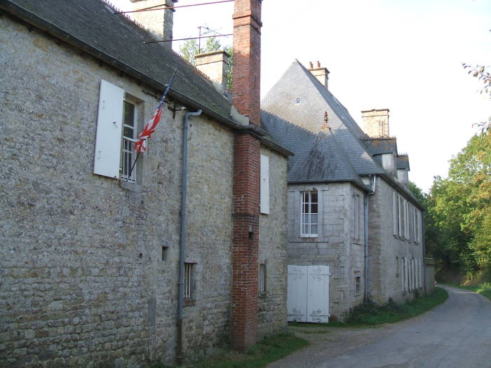 Brécourt Manor, just inland of Utah Beach.  Narrow road, old stone barn and estate.  D-Day battlefields surround it.