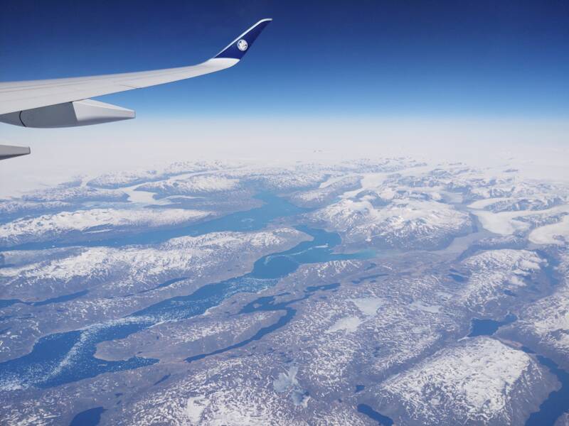 Flying across southern Greenland from north of Prince Christian Sound to just south of Qaqortoq, approaching the Labrador Sea, on board AF 136 2022-05-19.