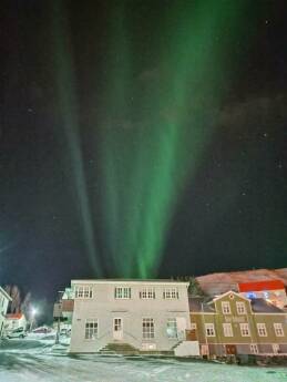 Aurora, the northern lights above Sauðárkrókur in northern Iceland.