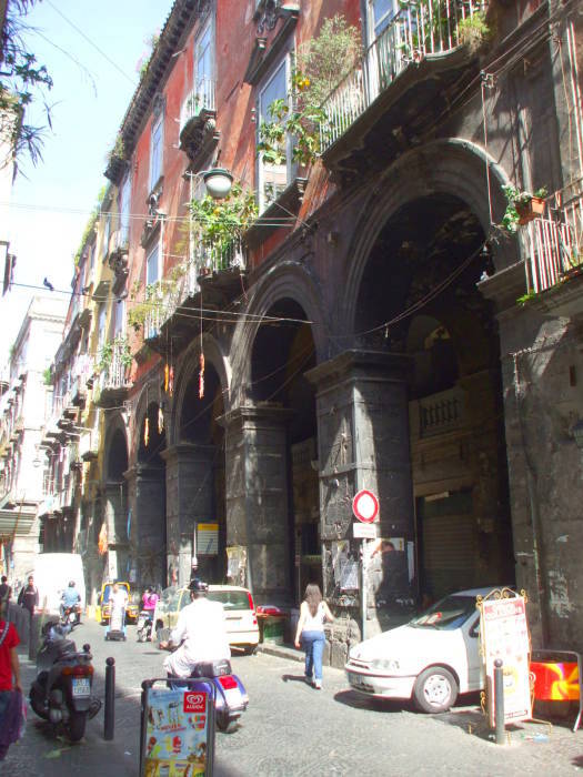 Large stone arches on a building in the Centro Storico in Naples.