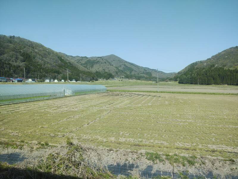 Farm fields and low mountains along the Ban-Etsusai Line from Kōriyama Station to Aizu-Wakamatsu.