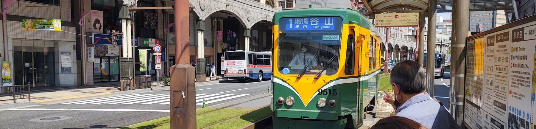 Tram #1 approaches the platform in Kagoshima's Tenmonkan shopping district.