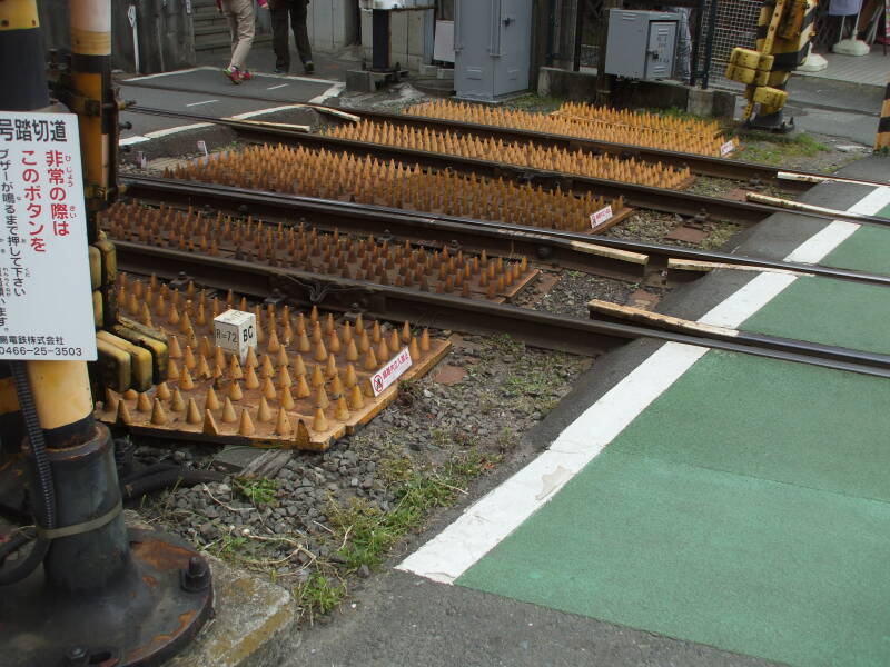 Spikes to prevent pedestrian and car incursions on train tracks, in Kamakura, Japan.