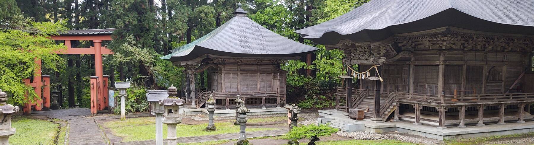 Vermillion torii from the 2,446-step path, Itsukushima Shrine, and Hachikosha with several stone lanterns, in the Dewasanzan shrine complex on the peak of Mount Haguro.