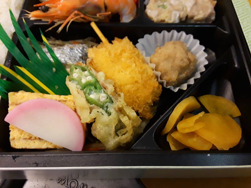 Opening my bentō box lunch on board the train from Hakata Station in Fukuoka to Nagasaki.