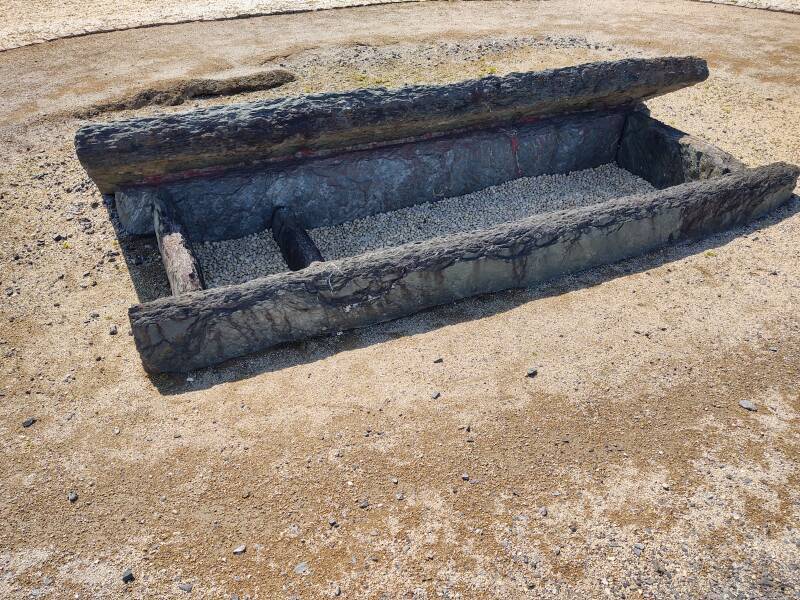 Dark stone coffin at the top of Kamezuka Kofun.