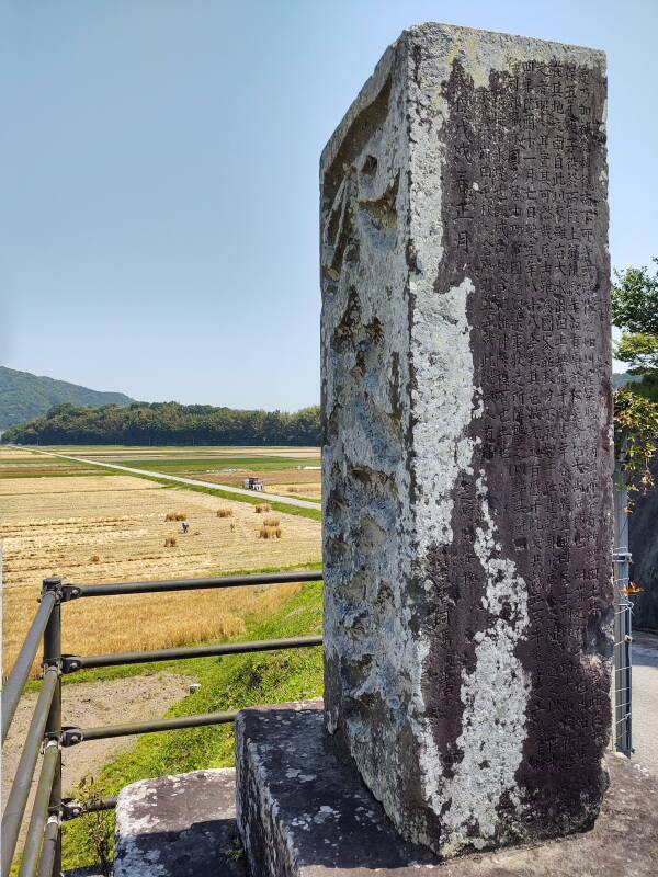 Stone monument 'Fukandzuka' honoring Fuku Hikida, along the road near the Stone Buddhas.