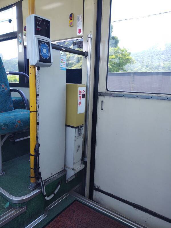 Ticket dispensing machine on board the bus from the Stone Buddhas to Usuki.