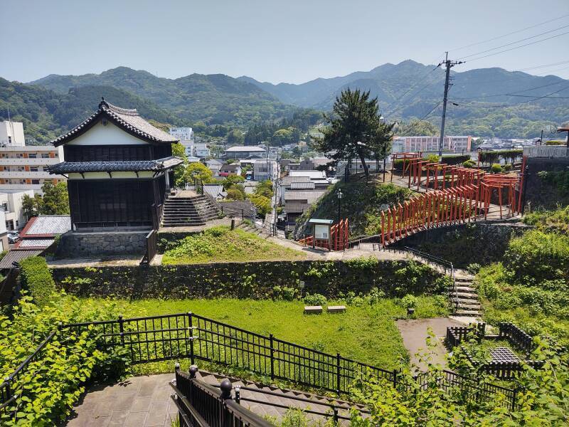 Restored three-story Utono-guchi tower and torii leading to Utono Inari Shrine.