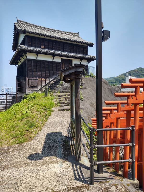Restored three-story Utono-guchi tower on outcropping of Usuki Castle.