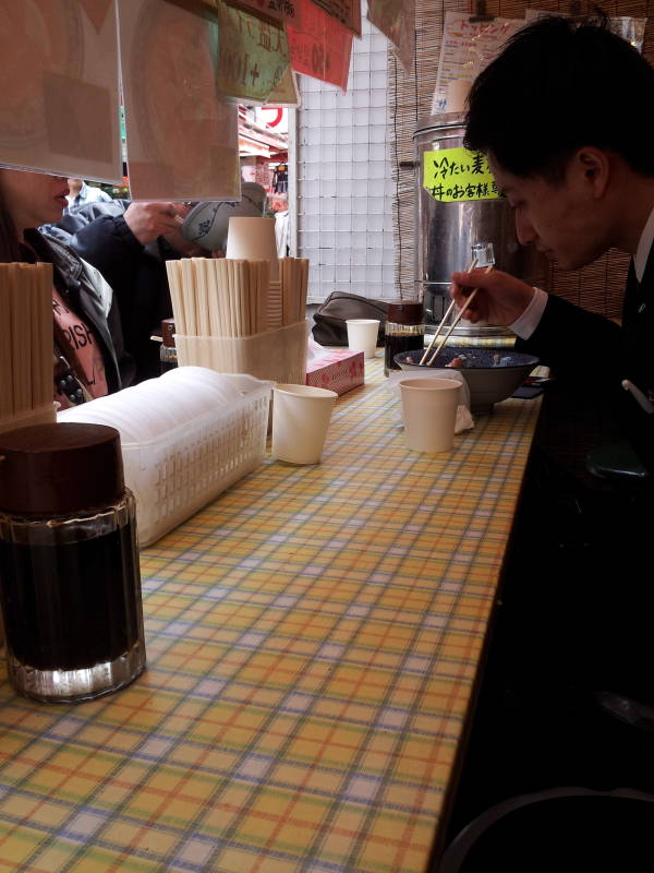 My seat at a small restaurant in the Ameya-Yokochō market under the Yamanote Line tracks.