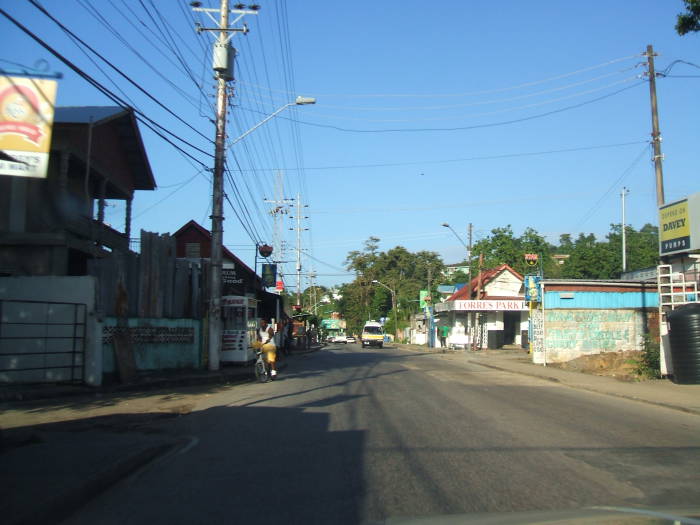 Driving through the small Trinidad village of Carenage, early in the morning.