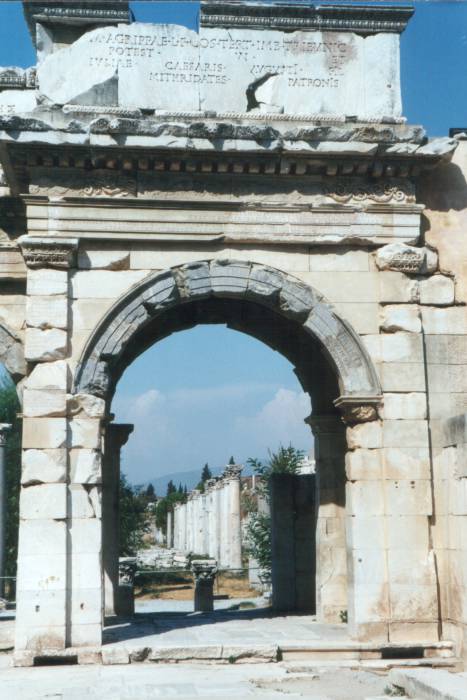 An arch leads west from the city center.