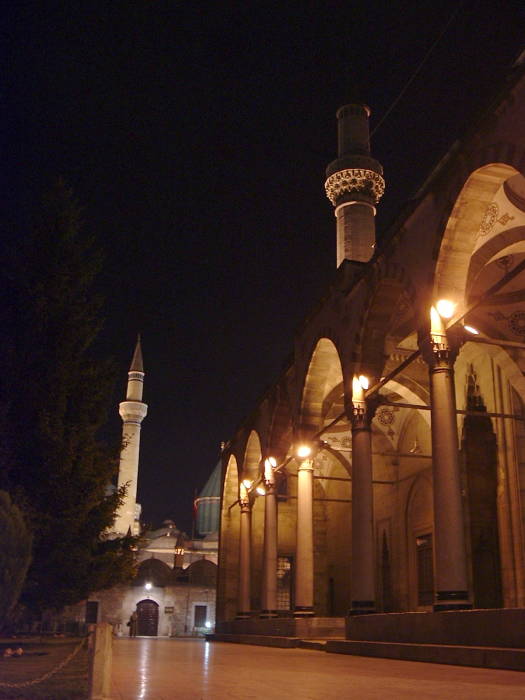 Night-time view across the front of Azizye Camii (Mosque) toward the Mevlâna Shrine, in Konya.
