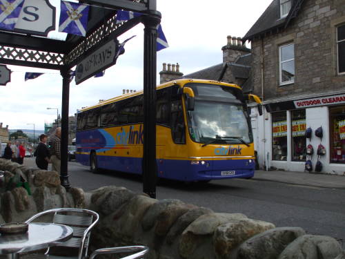 Traveling through the Scottish Highlands:  A Scotlink bus arrives in Pitlochry, Scotland.