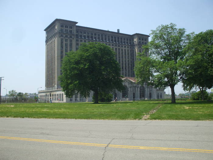 View from two abandoned houses to Detroit's Michigan Central Station.