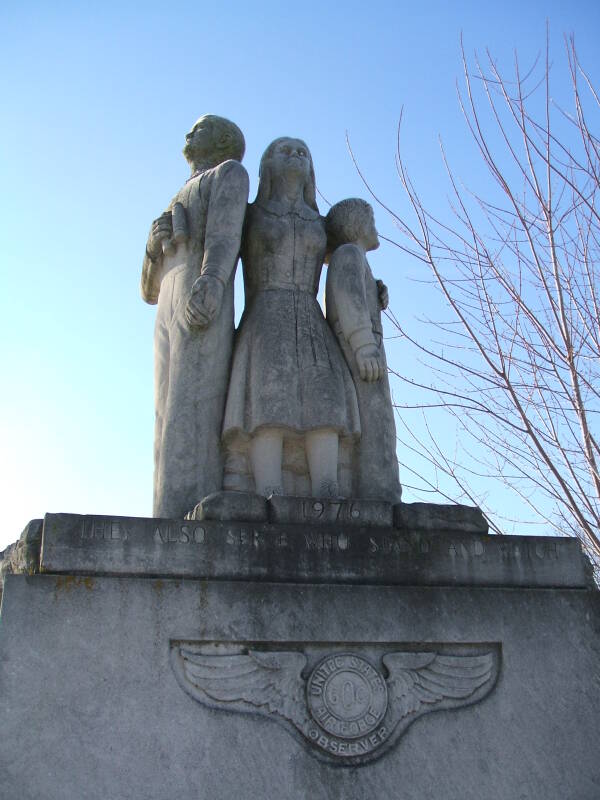 Limestone statue of three family members watching for Soviet bombers at the Cairo Cold War watchtower in northern Tippecanoe County, Indiana.