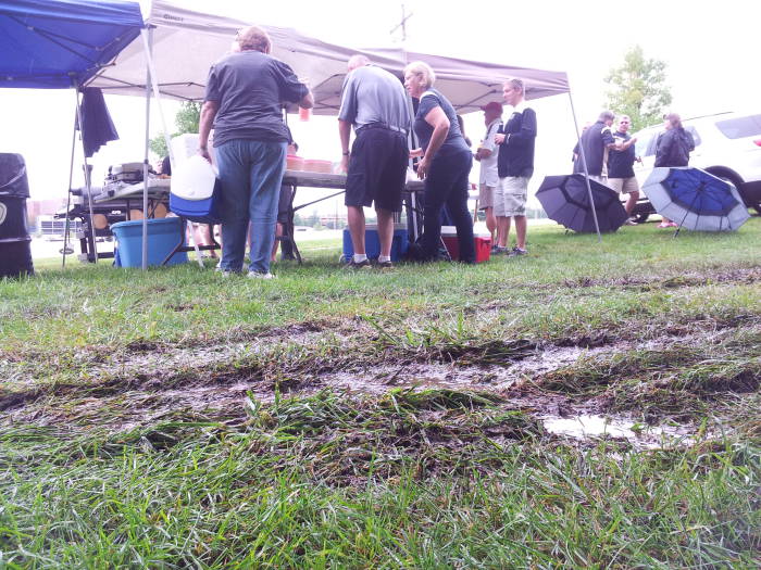 Car tracks in the mud: Purdue West Slayter Hill Tailgate Association, 10 September 2016.