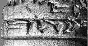 Close-up of cuneiform tablet showing sign details.