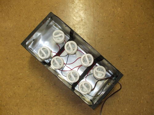 Large steel equipment case lined with aluminum flashing and 8 CFLs.
