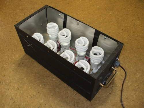 Large steel equipment case lined with aluminum flashing and 8 CFLs.