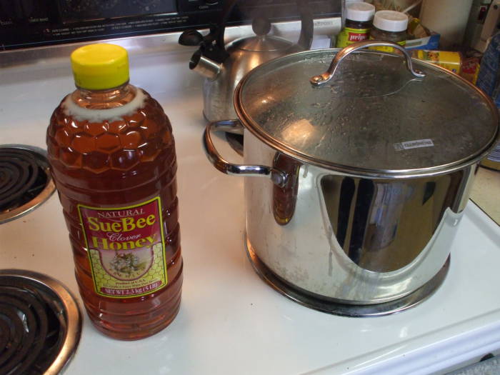 Brewing mead: honey and the boiling pot.