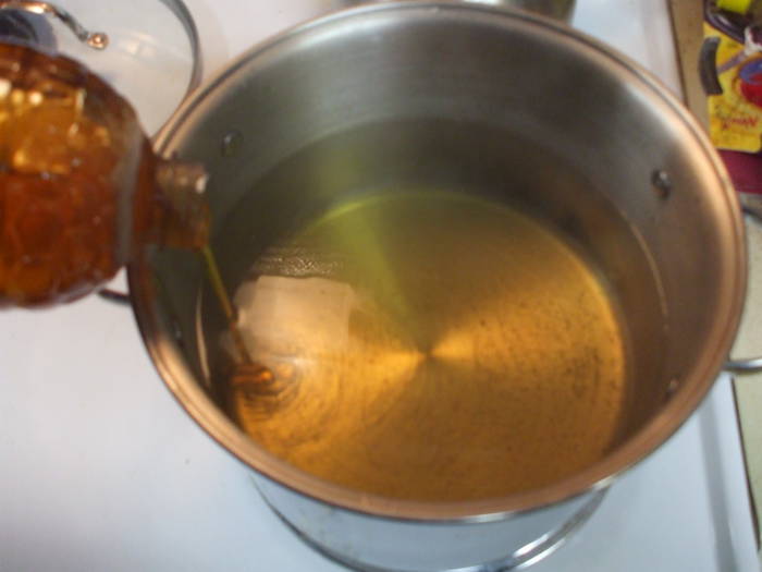 Brewing mead: Adding the honey to the boiling must.