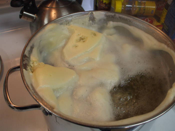 Brewing mead: The boiling must is topped by gloopy oobleck.