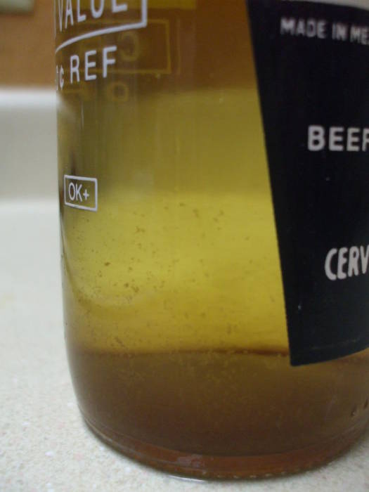 A clear bottle of home-brewed mead.