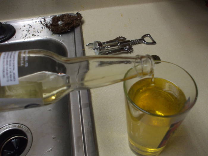 Pouring a glass of home-brewed mead.