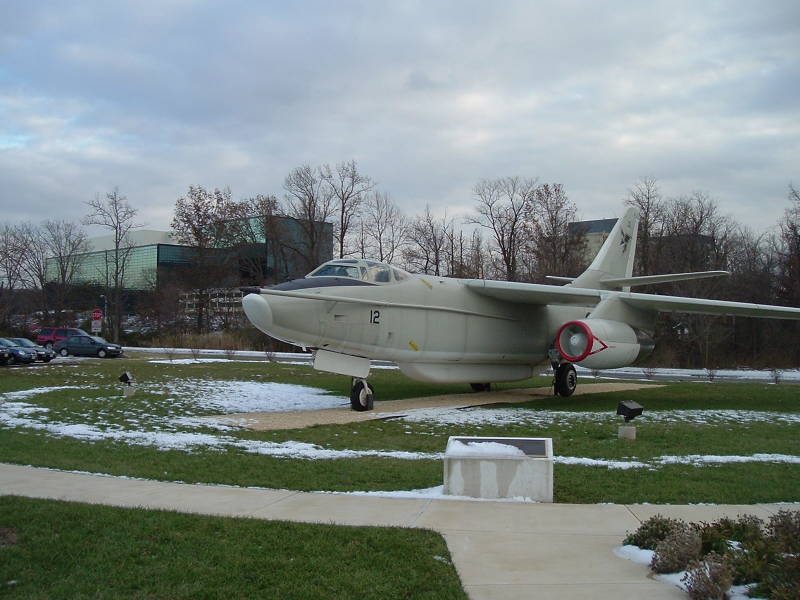 EA-3 aircraft used for SIGINT missions, NSA headquarters building in background.