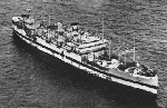 USS Samaritan, former USS Chaumont, at anchor 30 March 1944, during World War II in the Pacific.