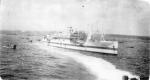 USS Samaritan, former USS Chaumont, off Iwo Jima in February 1945.  LSM-46 has just delivered wounded U.S. Marines on board for medical treatment.