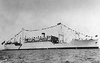 USS Chaumont dressed with flags in the South Pacific during World War II.