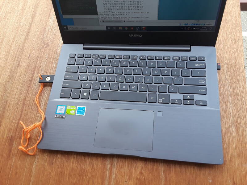 YubiKey authentication device plugged into a laptop.