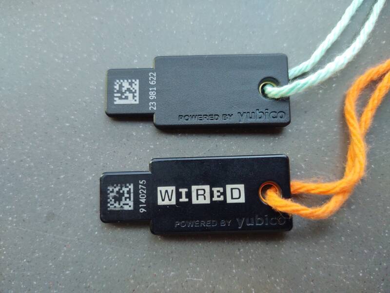 YubiKey 4 and YubiKey 5 devices on colored yarn.