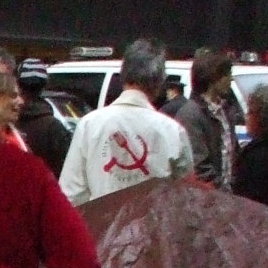 Occupy Wall Street protestor wearing communist hammer and sickle logo.