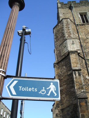 Funny sign in England.  Giant toilet this direction!