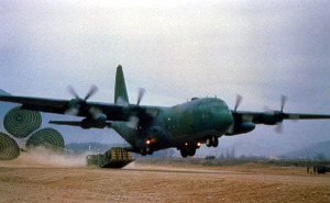 Low-altitude high-speed cargo drop from a Hercules C130 cargo aircraft.