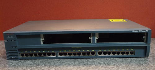 Cisco Catalyst 2924XL-M Ethernet switch.  Module covers removed.