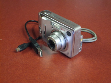 Fuji FinePix digital camera with USB cable.