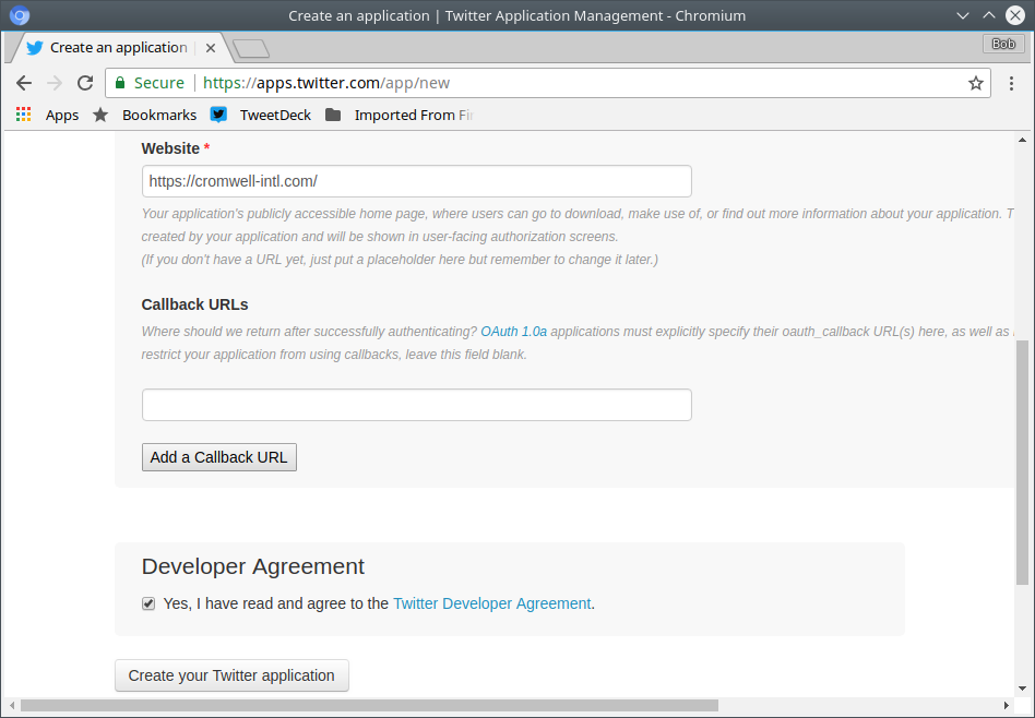 Setting the Twitter application website and callback URLs, and agreeing to the developer agreement.
