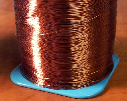 Spool of #34 enameled copper wire.