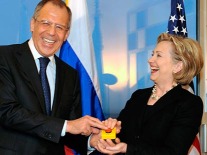 Russian Foreign Minister Sergei Lavrov laughs at American incompetence as U.S. Secretary of State cackles.